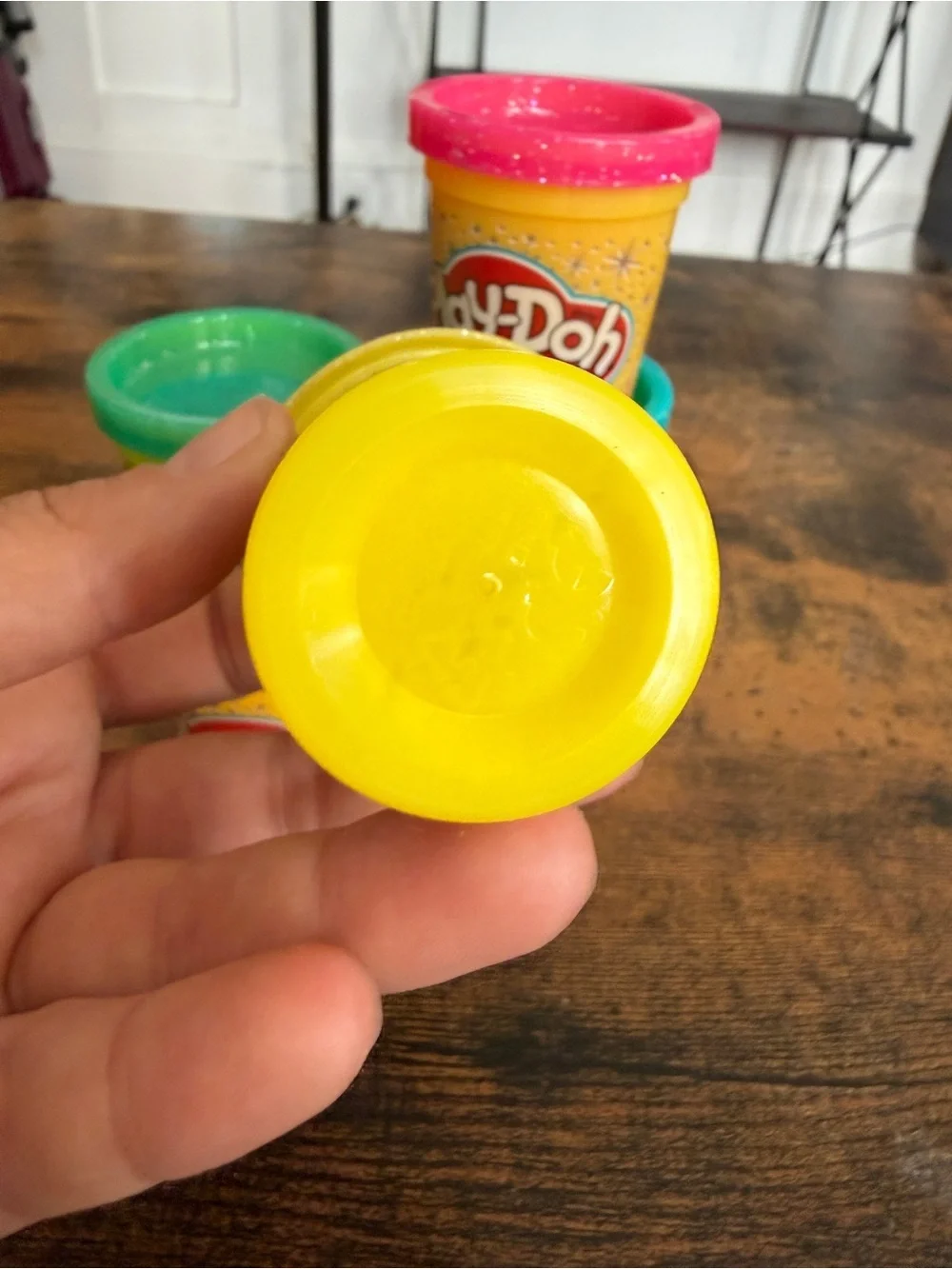 Play-Doh small Yellow with Pink, Teal, Purple, and Green Lids comes with all